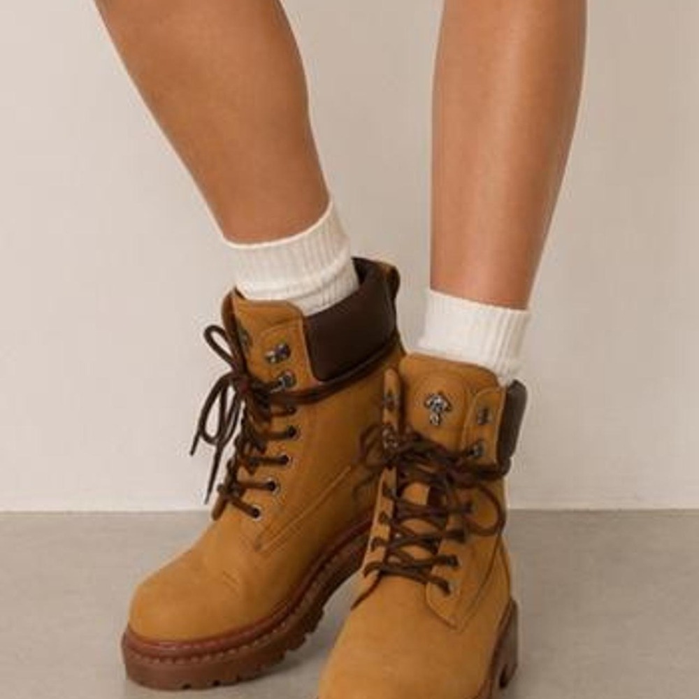 Brand new lace-up combat boots in a classic tan color
